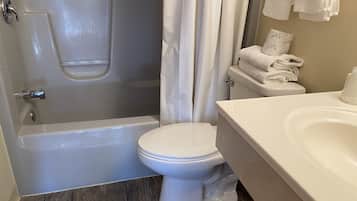 Combined shower/bathtub, towels, soap, shampoo