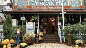 A building with a sign reading "General Mercantile" and "Shoes, Firewood, Clothing." - Beech Mtn- Amazing View+1 Mile to Ski Beech - Walking distance to Overlook Barn (Beech Mountain)