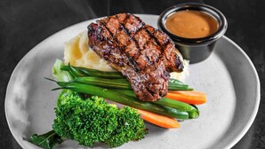 A plate with grilled steak, mashed potatoes, steamed vegetables, and a side of sauce. - Colliery Inn, Wallsend (Wallsend)