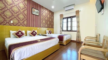 Triple Room | Minibar, in-room safe, desk, blackout curtains