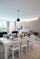 Apartment, 2 Bedrooms, Partial Sea View | Living area | 100-cm flat-screen TV with cable channels, TV