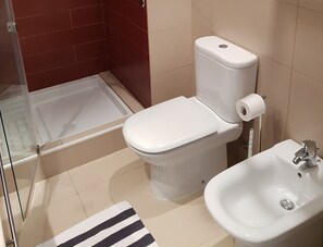 A bathroom with a toilet, bidet, and sink. - STUNNING 2-BEDROOM LUXURY APARTMENT, TOP FLOOR, GREAT VIEW, IN MARINA VILLAGE (Lagos)