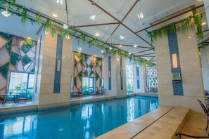 Indoor pool, open 10:00 AM to 5:00 PM, pool loungers