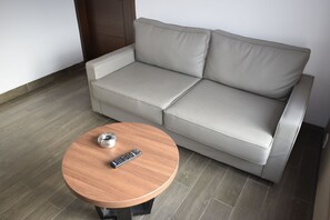 Standard Double Room | Living area | 32-inch LCD TV with cable channels