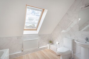 Combined shower/tub, hair dryer, towels, soap