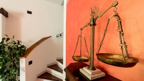 A staircase with a wooden handrail and a potted plant. - VILLA IARA IN CERVETERI WITH PRIVATE SWIMMING POOL (Cerveteri)