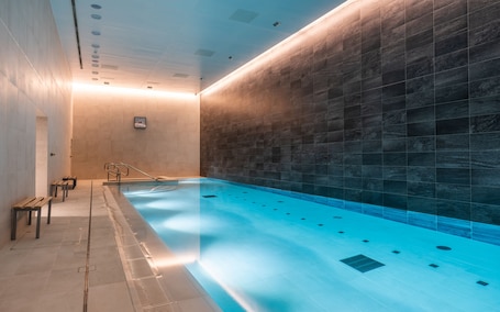 Indoor pool, open 6:00 AM to 10:00 PM, pool loungers. CitySuites 2 Aparthotel