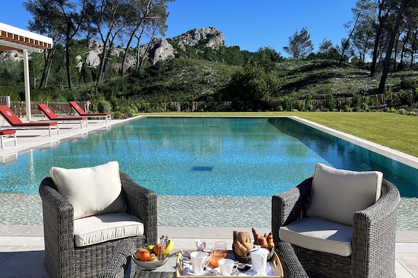 Seasonal outdoor pool, open 8:00 AM to 7:00 PM, pool umbrellas