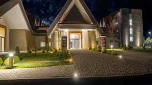 A hotel entrance with a modern design, featuring a central entrance flanked by two wings. - Zephyr Ifrane (Ifrane)