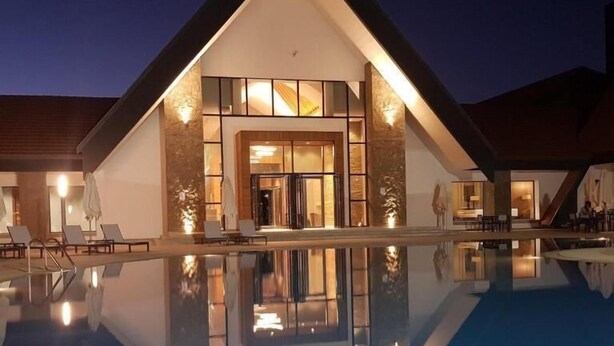 A modern hotel with a large pool, reflecting the building's architecture. - Zephyr Ifrane (Ifrane)