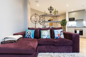 Basic Apartment, Multiple Beds | Living room | TV