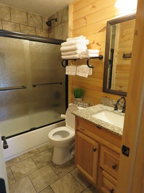 Combined shower/tub, hair dryer, towels, soap