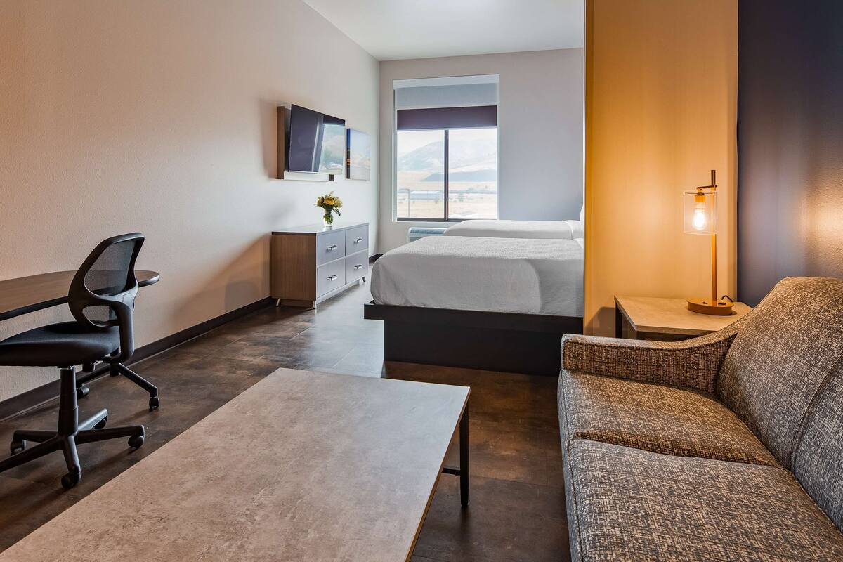 hypo-allergenic bedding, desk, laptop workspace, blackout curtains