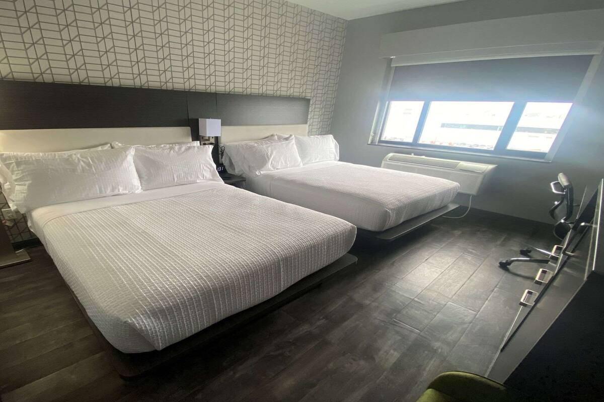 Premium bedding, memory foam beds, desk, laptop workspace
