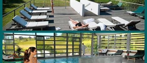 Zona de piscina en la azotea con sillones reclinables y vistas del paisaje circundante.