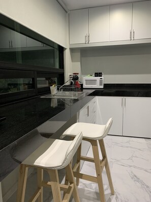 Fridge, microwave, stovetop, coffee/tea maker