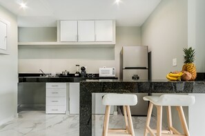 Fridge, microwave, stovetop, coffee/tea maker