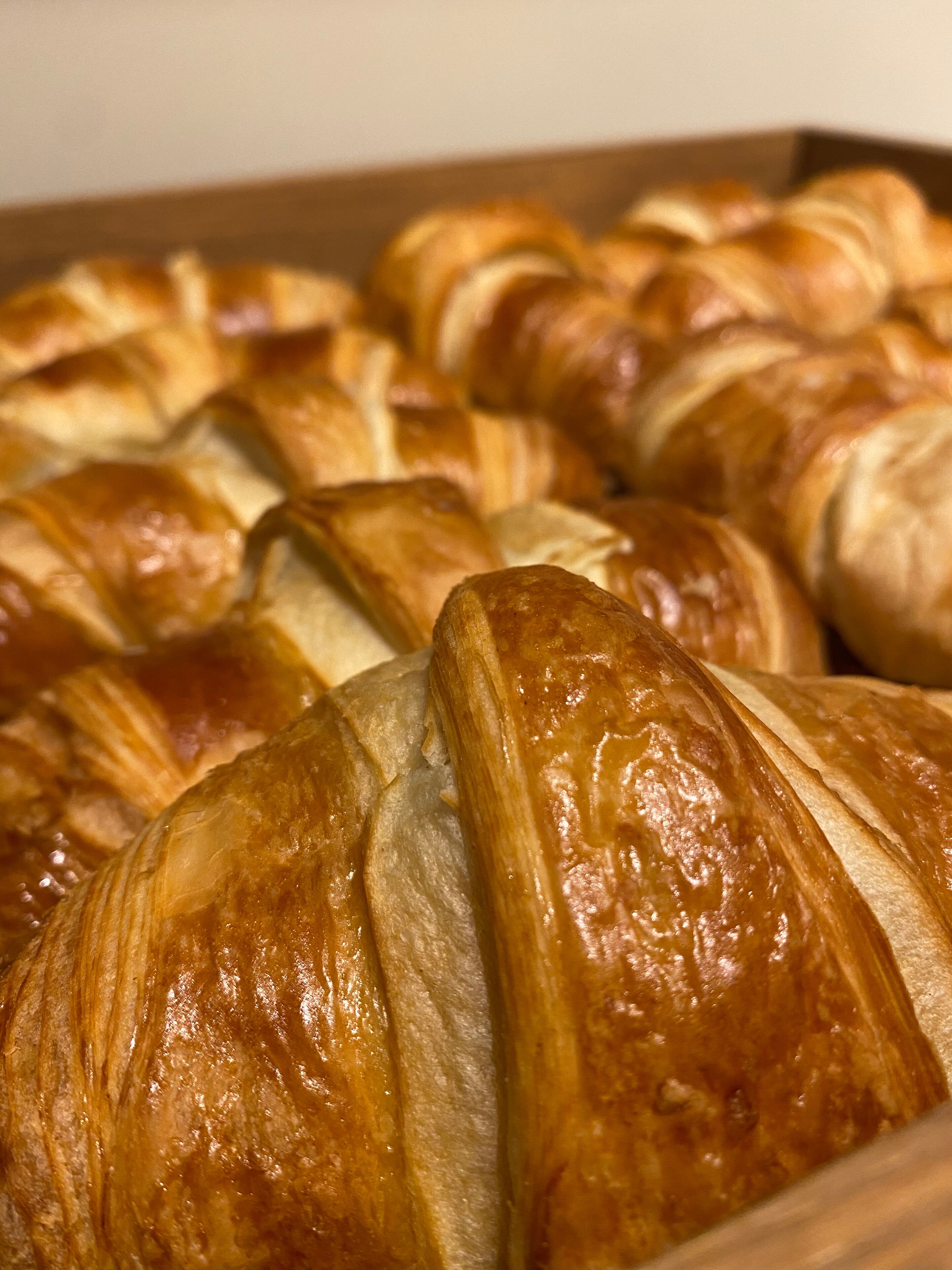A box of freshly baked croissants.