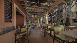 An indoor dining area with ceiling fans, tables, and chairs. - Marriott's Ocean Front Barony Beach Club Resort Hilton Head, SC (Hilton Head Island)