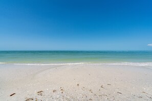 On the beach, sun loungers, beach towels