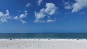 A beach with a clear sky and calm sea. - Gulf Coast / Direct Beachfront View - Steps to Sand & Sunset (Fort Myers Beach)