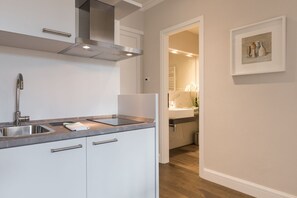 Fridge, microwave, stovetop, coffee/tea maker