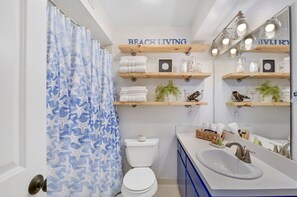Combined shower/bathtub, hair dryer, towels, soap -  J&R Island Retreat Renovated Home w/ Low Rates! (St. Simons Island)