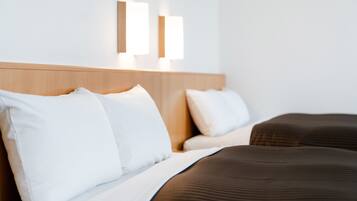 Down comforters, desk, blackout drapes, WiFi (free)