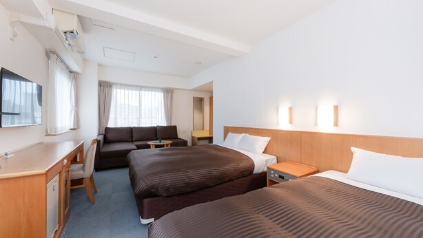 A hotel room with a bed, a desk, a sofa, and a TV. - The OneFive Osaka Sakaisuji (Osaka)