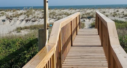 Charming Beachfront Cottage Awaits You! Direct access to beach off deck/walkway.