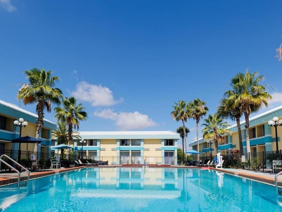 Outdoor pool, open 9:00 AM to 9:00 PM, pool umbrellas, pool loungers