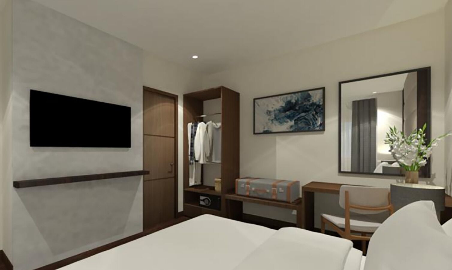 Une chambre d’hôtel moderne équipée d’un lit, d’un bureau, d’une armoire, d’une télévision et d’un miroir dans la salle de bain.