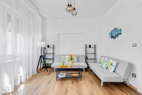 Living area - Modern 130 sqm apartment with two balconies, able to accommodate 8 people, located on the 4th floor of a modern building with lift (NOT suitable for the disabled - 6 steps to access to it). The property is located near via Libertà, in an area full of se (Palermo)