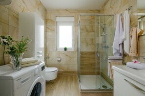 Shower, hair dryer, towels, soap