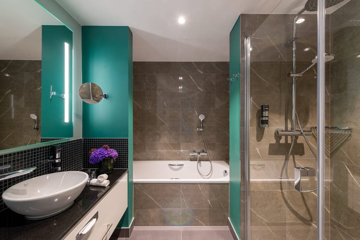 junior suite | bathroom | eco-friendly toiletries, hair dryer, towels