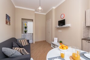 Apartment | Living area | 32-inch flat-screen TV with digital channels, TV - Cialdini Apartment near City Center (Turin)