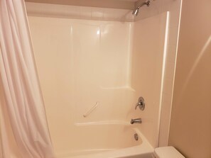 Bathtub, hair dryer, towels