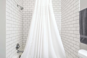 Bathtub, hair dryer, towels