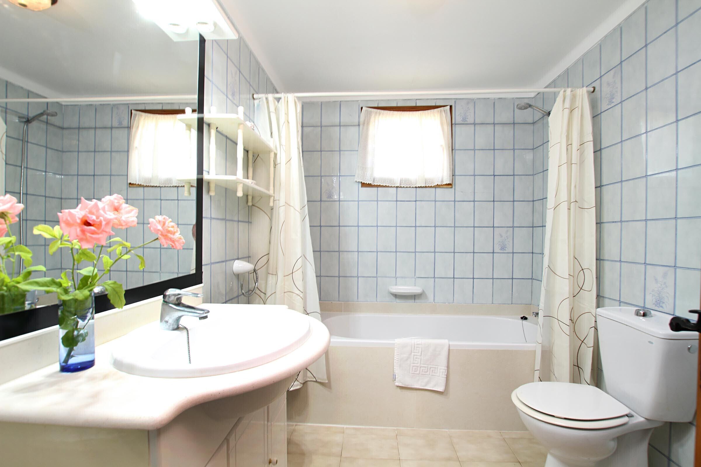 Bathtub, hair dryer, towels