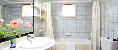 Bathtub, hair dryer, towels