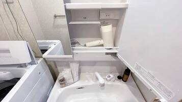 Bathtub, hair dryer, towels