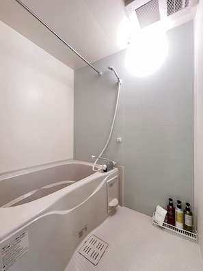 Bathtub, hair dryer, towels