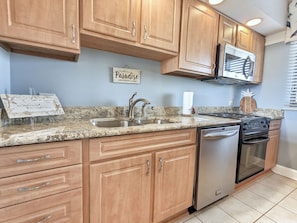 Fridge, microwave, oven, cookware/dishes/utensils