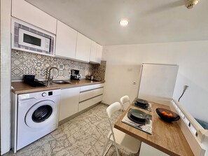Fridge, microwave, stovetop, coffee/tea maker