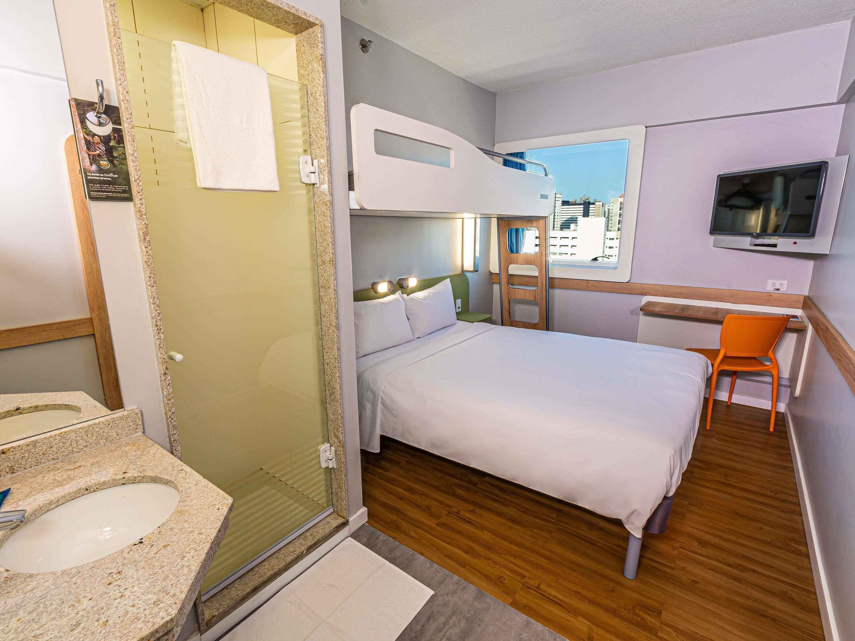 Desk, laptop workspace, blackout curtains, free cots/infant beds