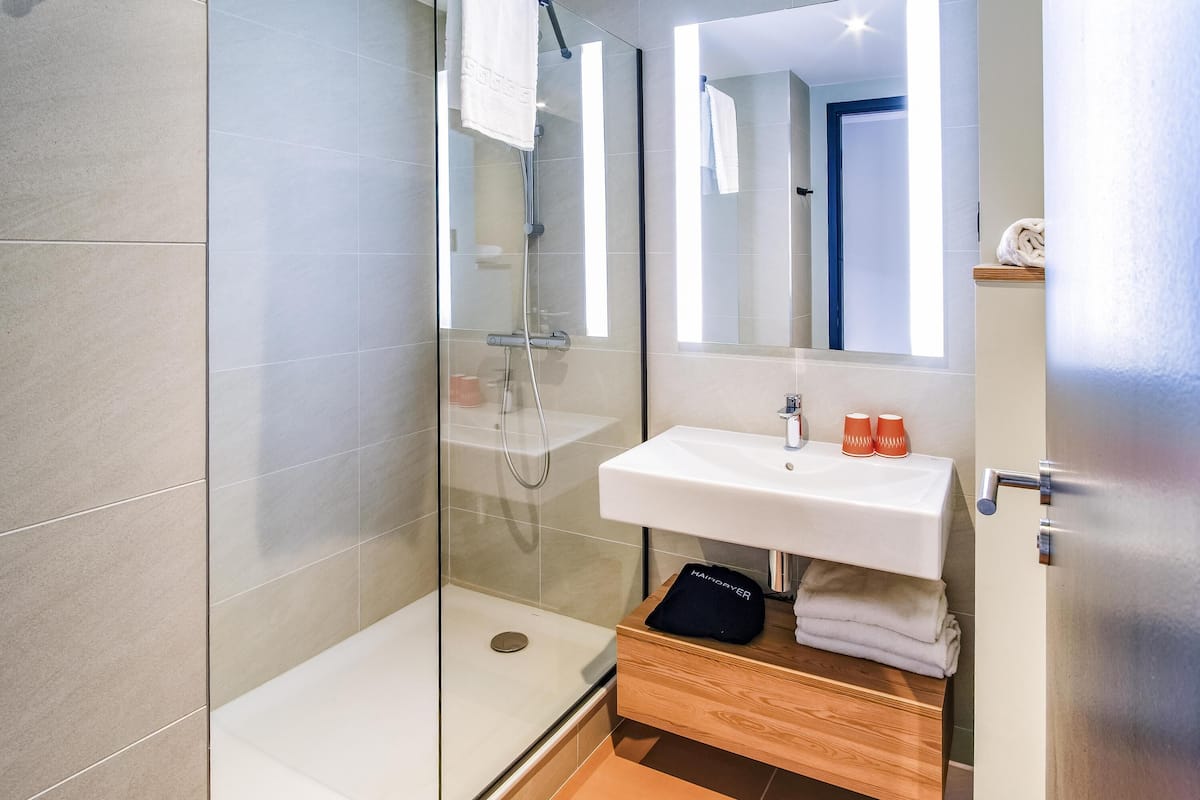 Blackout curtains, soundproofing, free WiFi, bed sheets