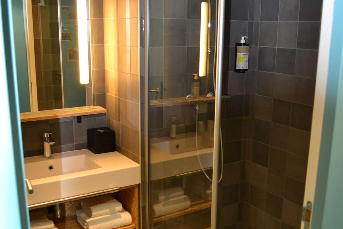 shower, eco-friendly toiletries, hair dryer, towels