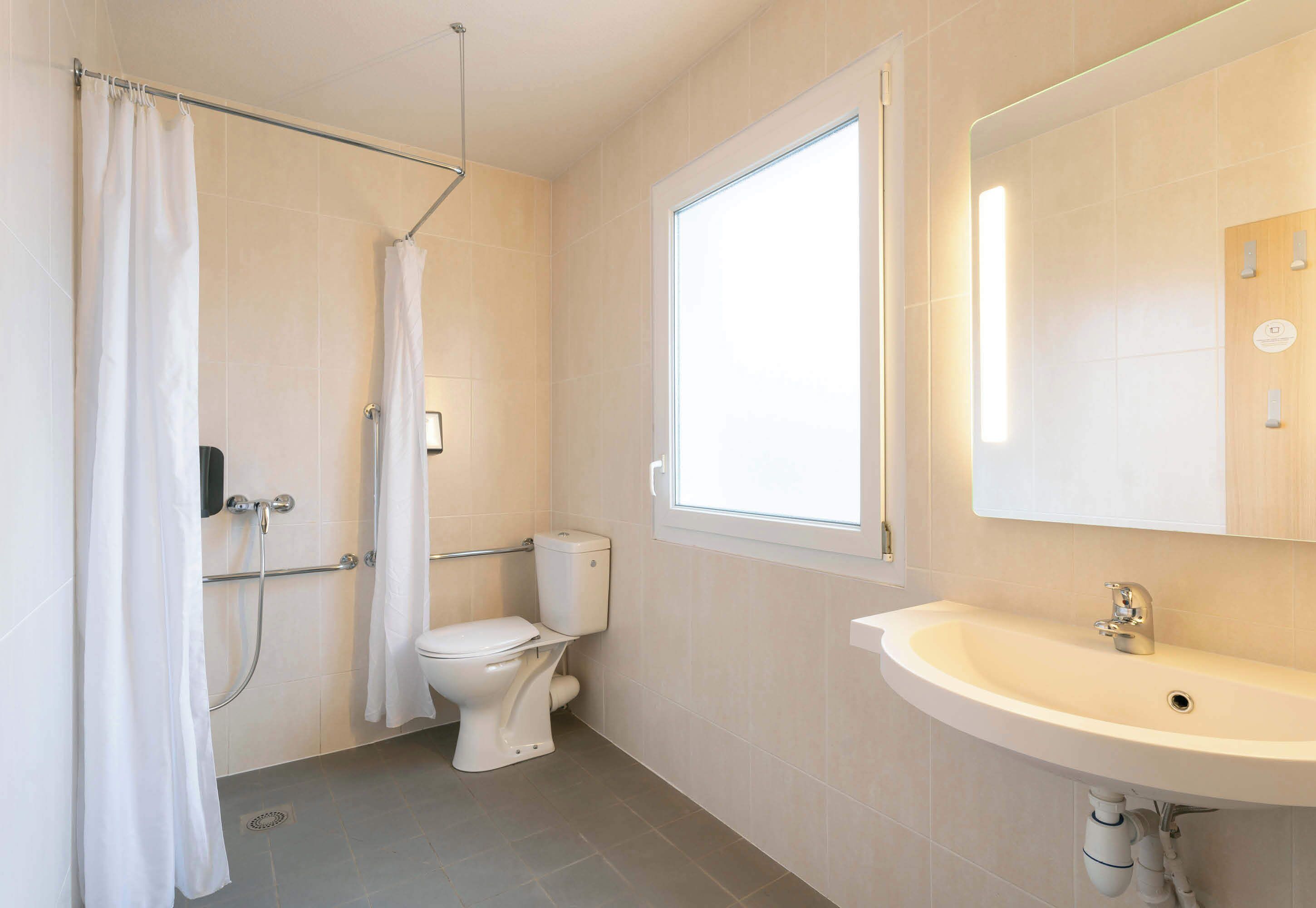 double room, mobility accessible | bathroom | shower, towels, soap, toilet paper