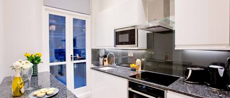 One bedroom Manhattan Apartment | Private kitchen | Full-size fridge, microwave, oven, stovetop