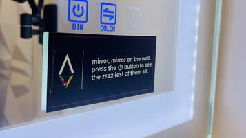 A control panel with buttons labeled DIM, COLOR, and DEFOG.